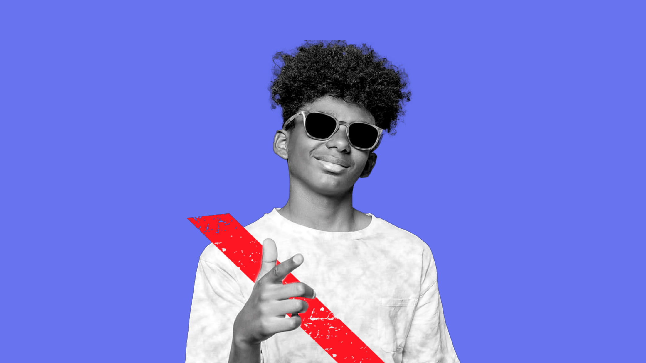 Young boy being a Backseat Boss while wearing a seat belt and sunglasses