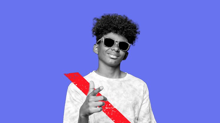 Young boy being a Backseat Boss while wearing a seat belt and sunglasses