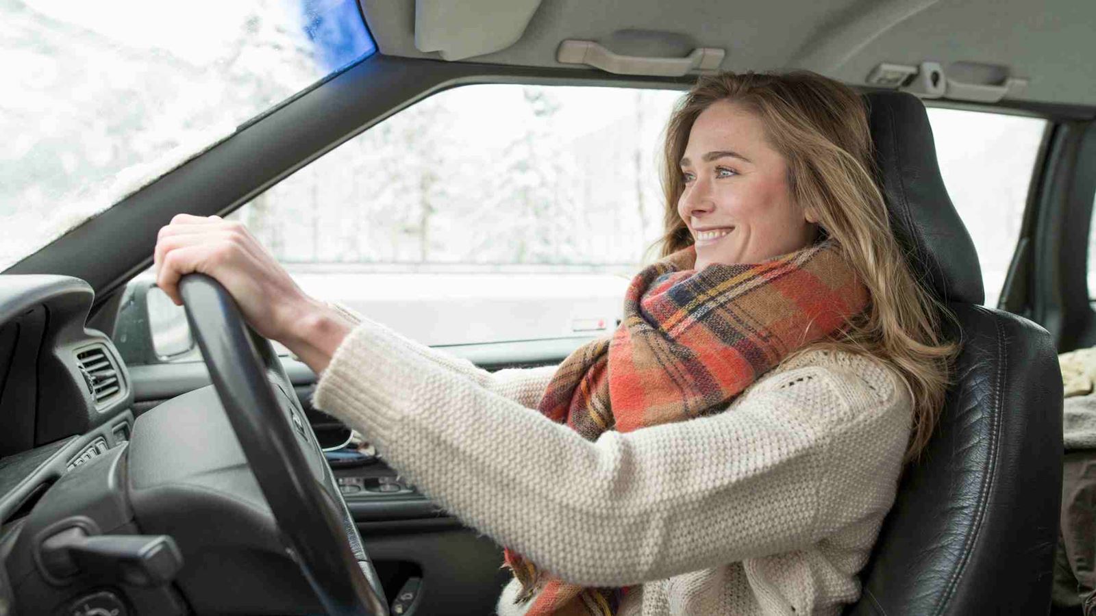 Woman driving a car during winter