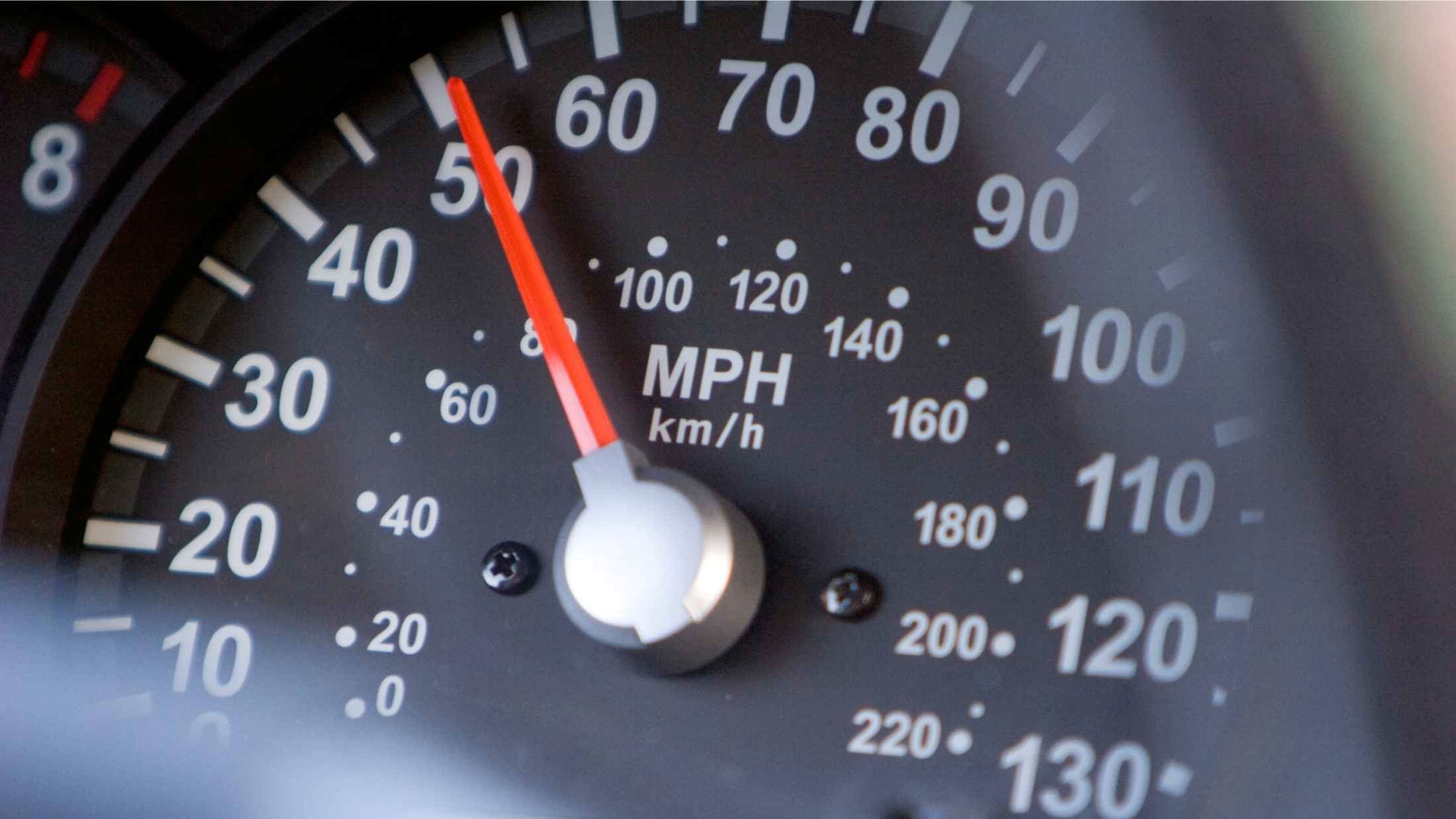 A speedometer registering 50 miles per hour