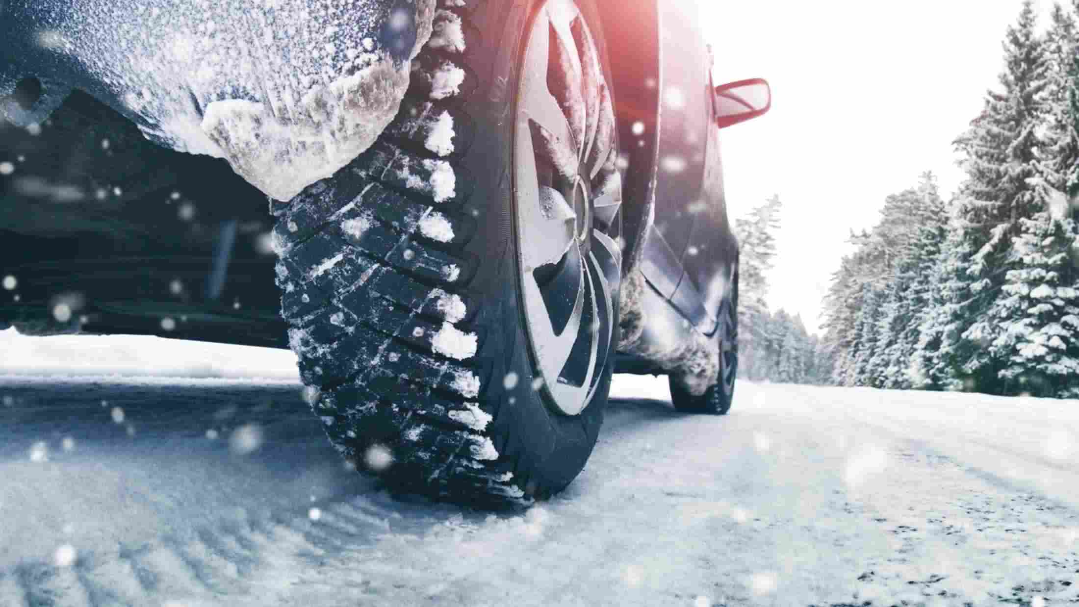 Car driving a road cover in snow