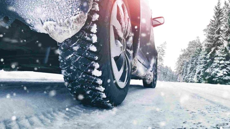 Car driving a road cover in snow