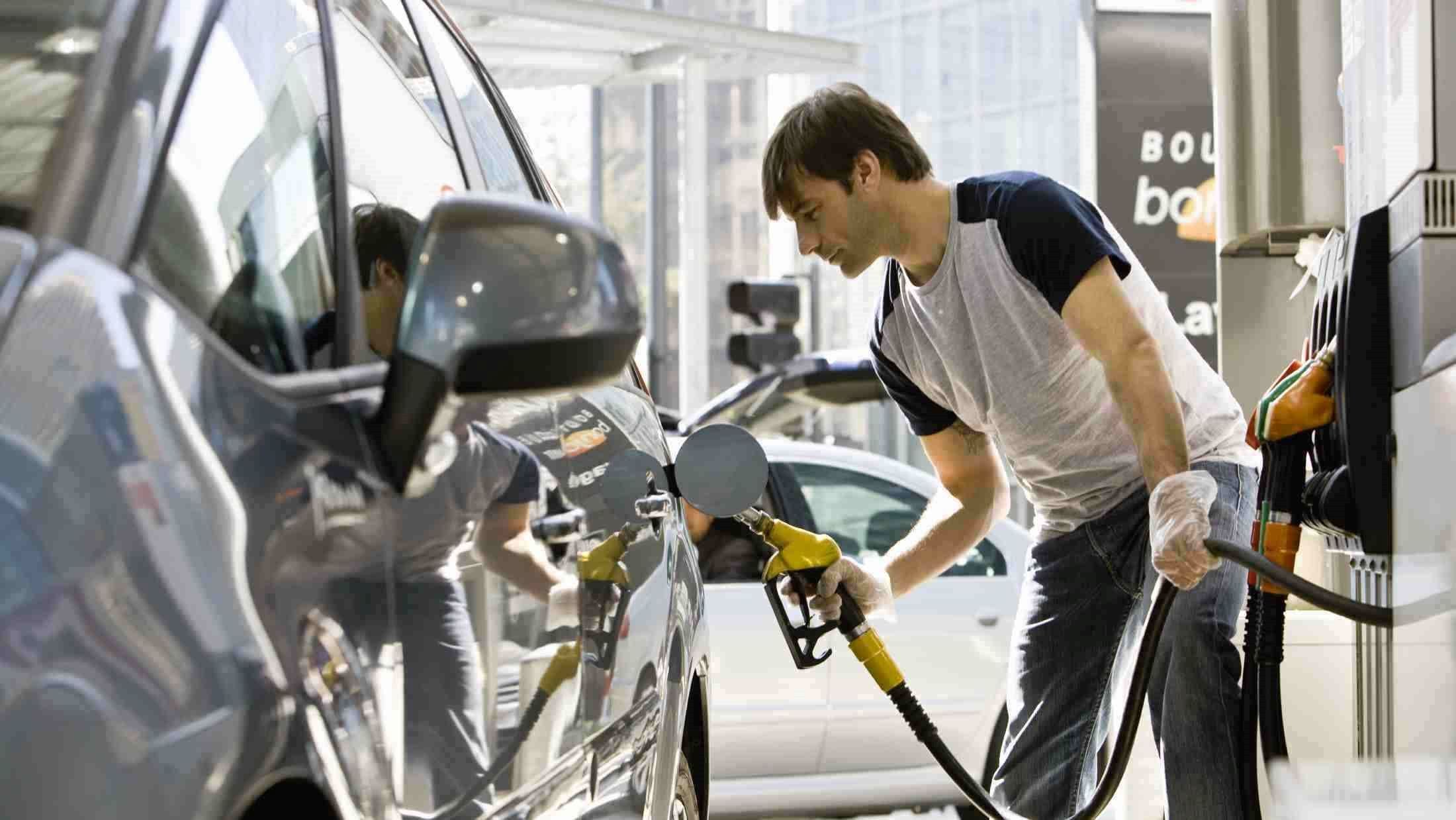 A man fuelling his car with petrol