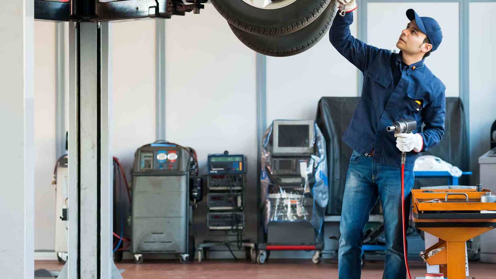 Mechanic working on the underside of a car