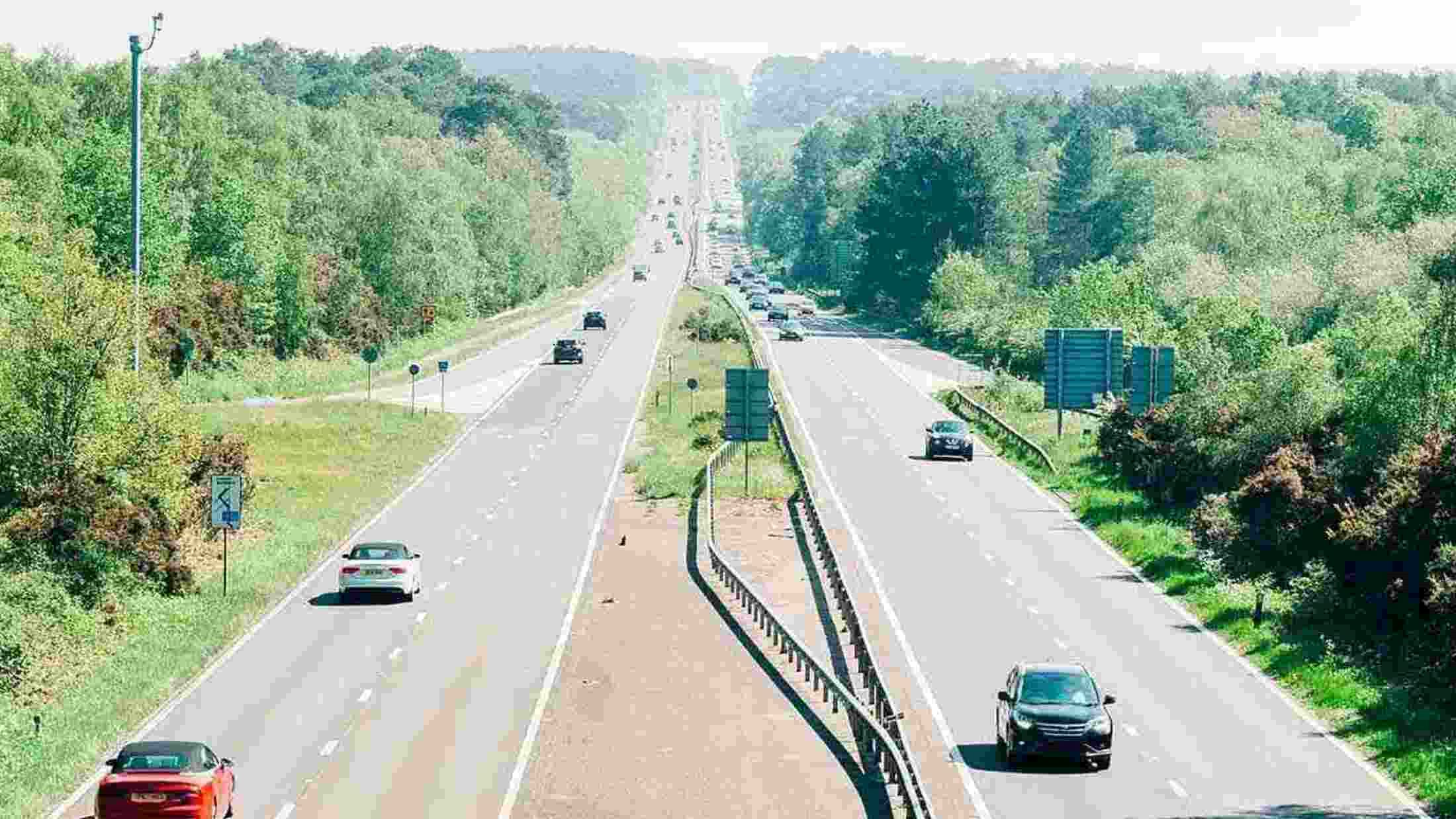 Motorway with cars driving on it