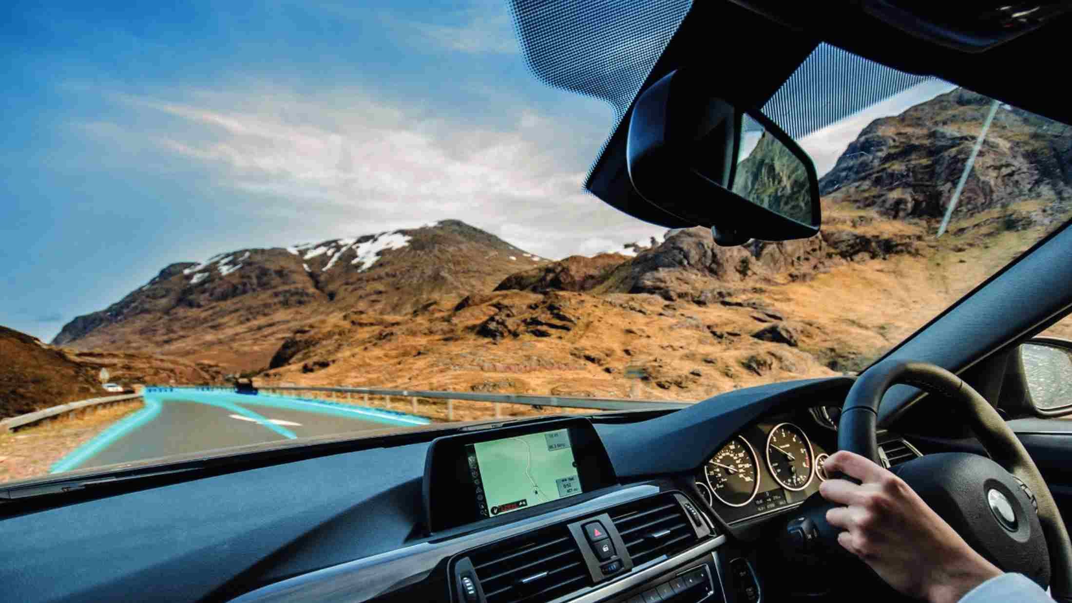 A driver, driving through the highlands