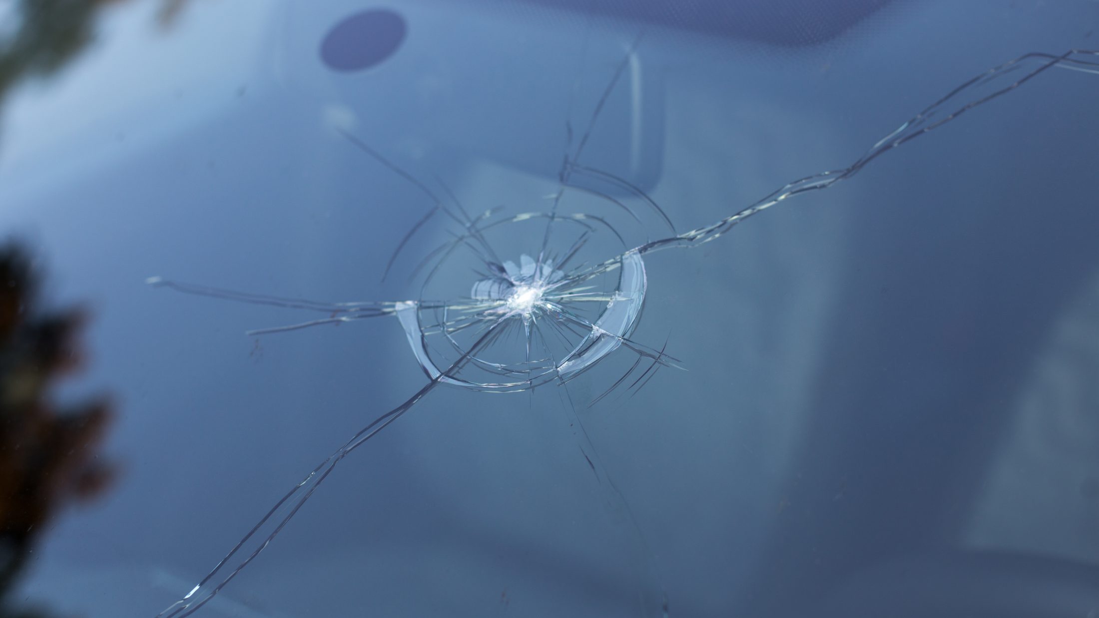 Smashed windscreen of a car, damaged glass