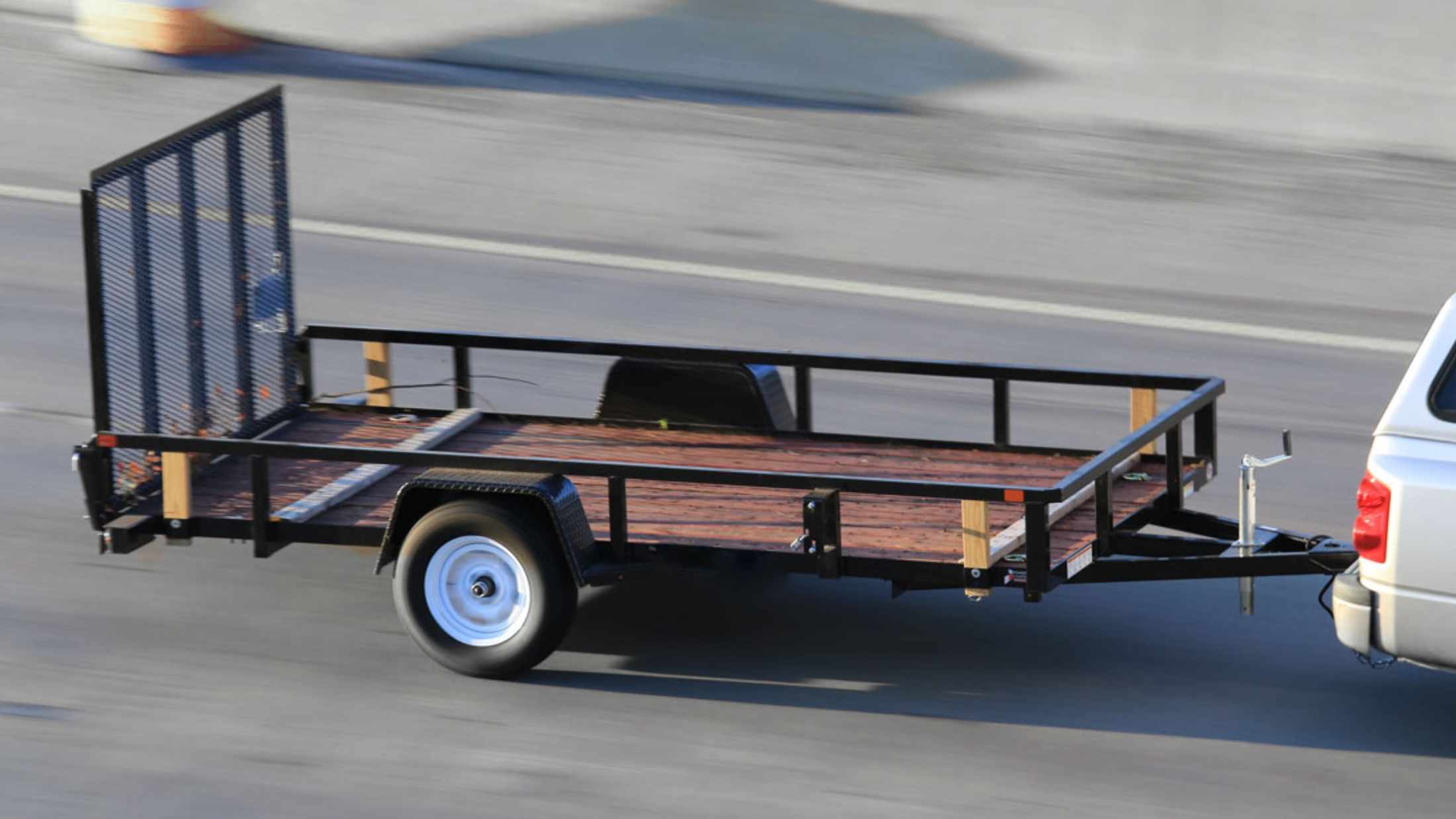 A utility trailer being pulled on the motorway