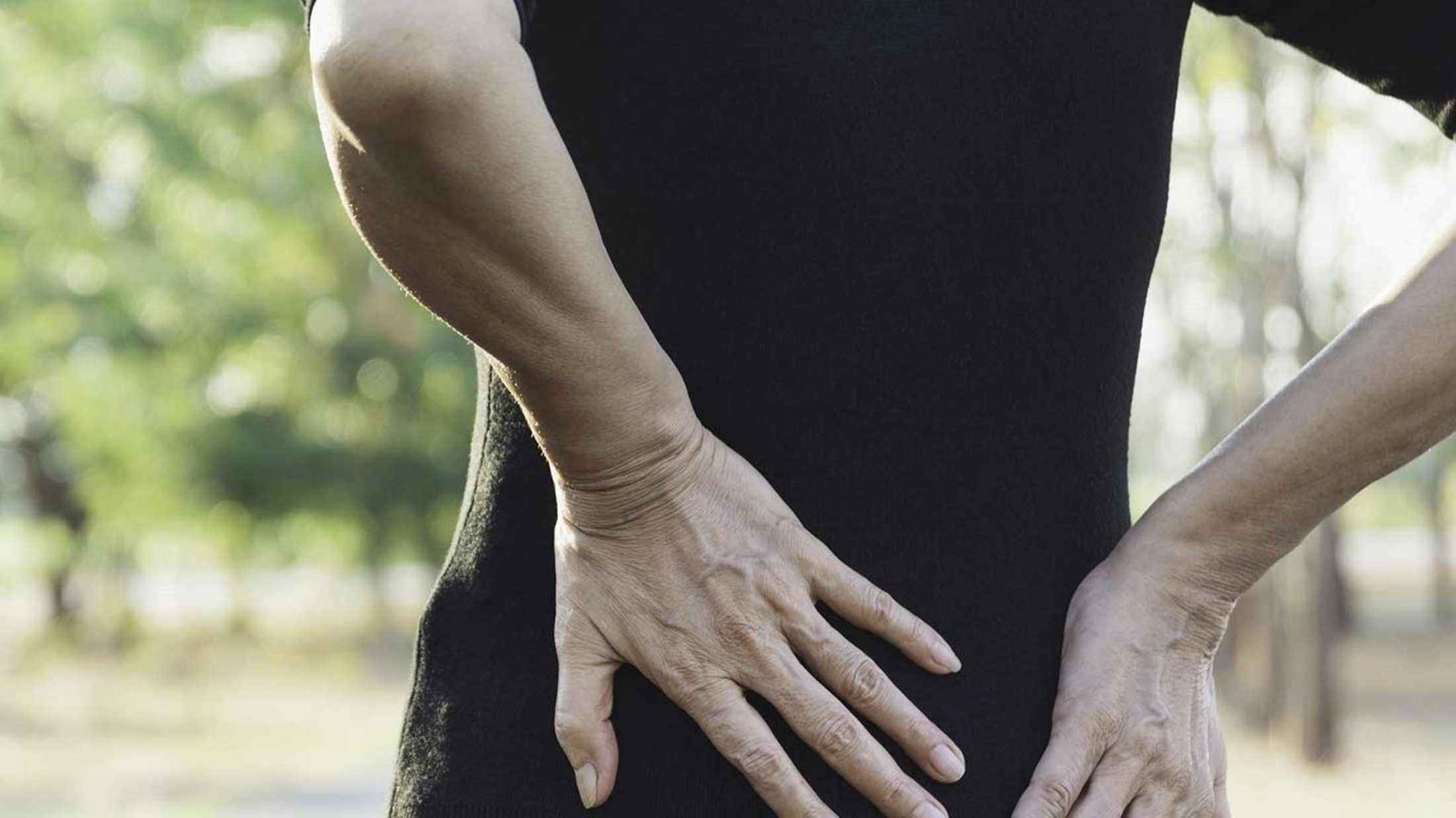 A woman stretching her back
