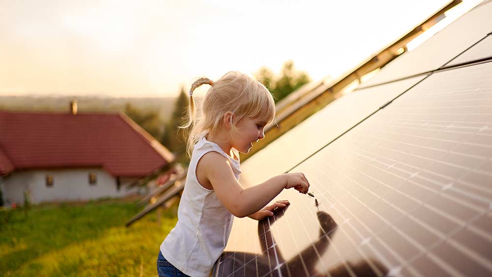 child touching solar panels.jpg