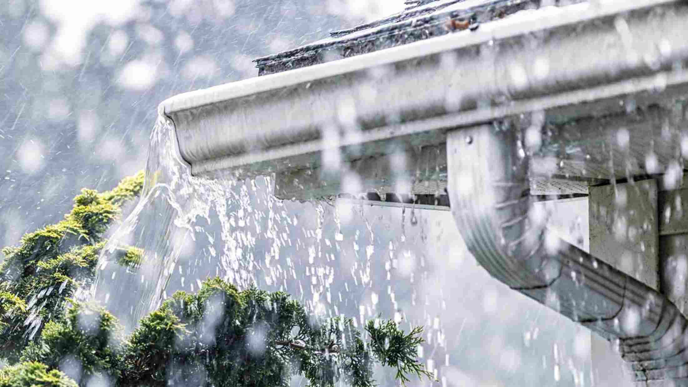 heavy rain hitting house roof during storm