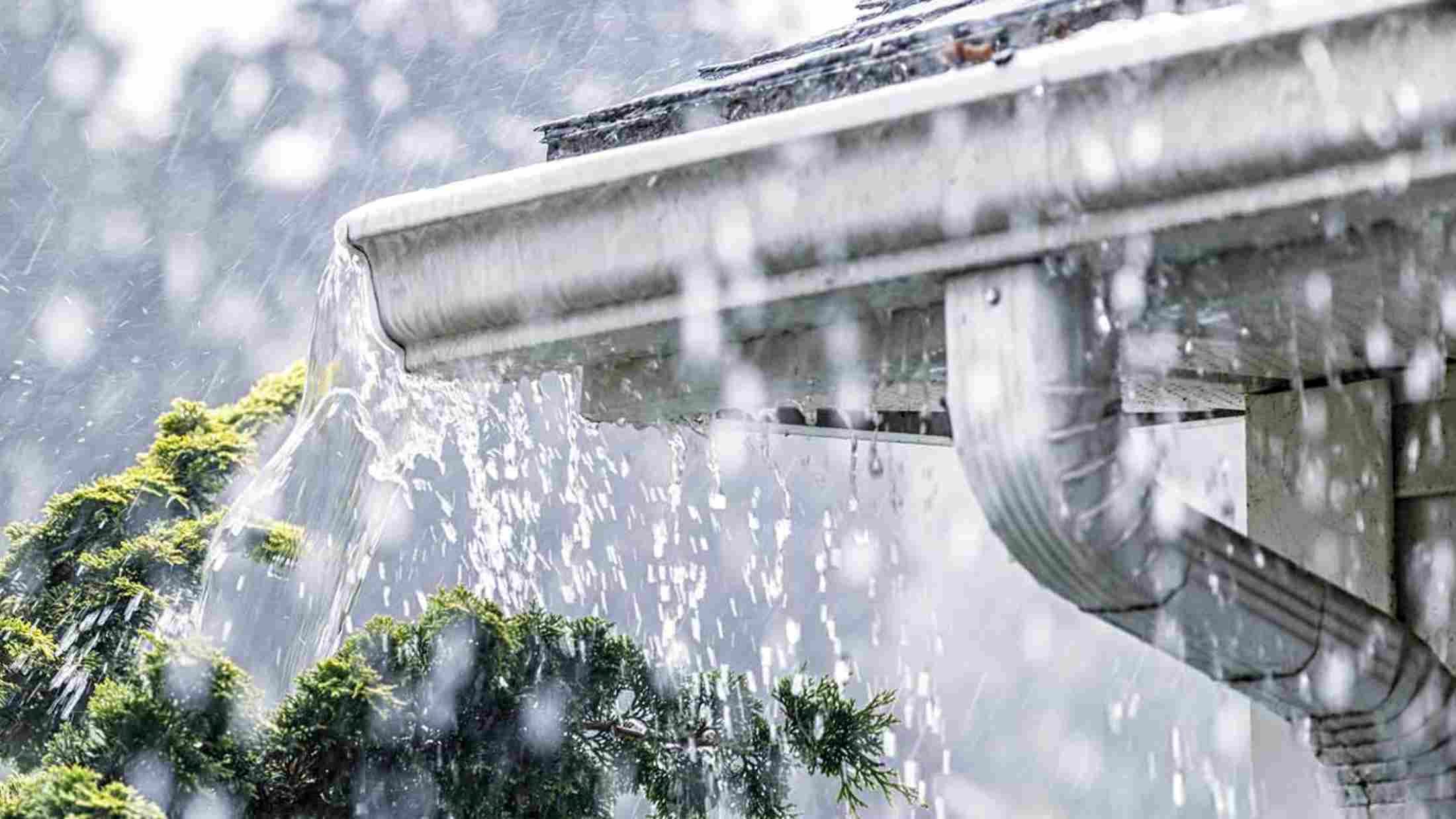 heavy rain hitting house roof during storm