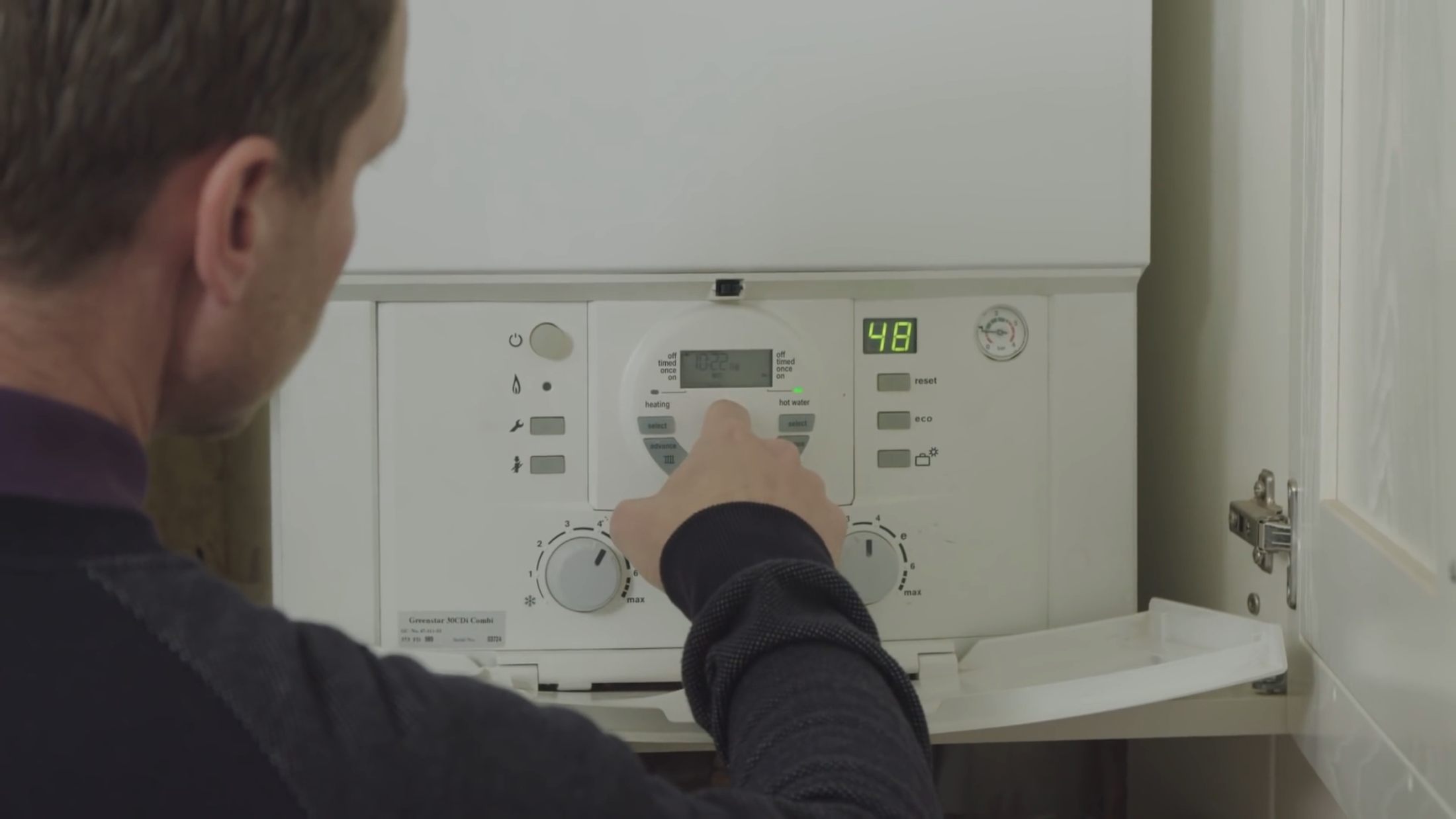 Man checking boiler