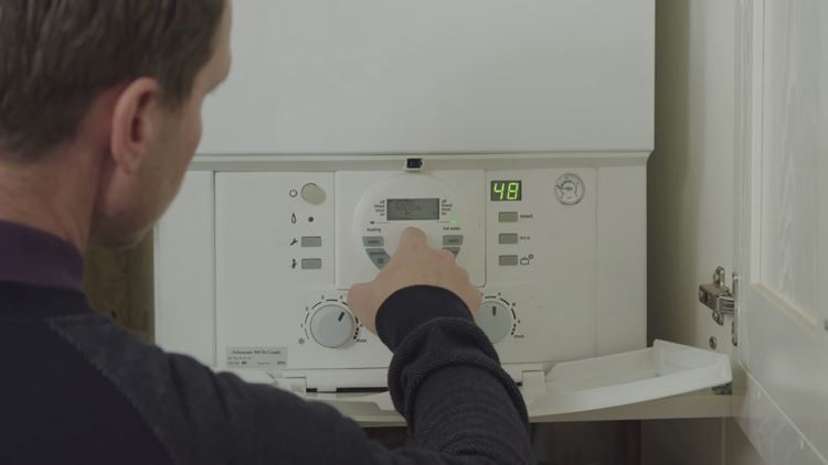 Man checking boiler