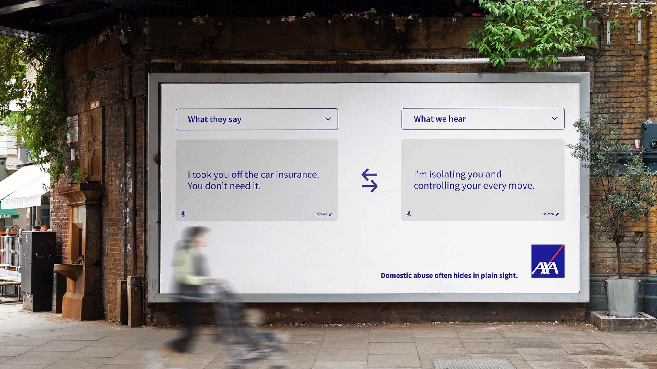 AXA's Domestic Abuse campaign shown on a billboard. On the billboard is a translation app, which features on the left 'What they say' and the text 'I took you off the car insurance. You don't need it.' On the right the heading is 'What we hear' and the text 'I'm isolating you and controlling your ever move'. Below is the text 'Domestic abuse often hides in plain sight.