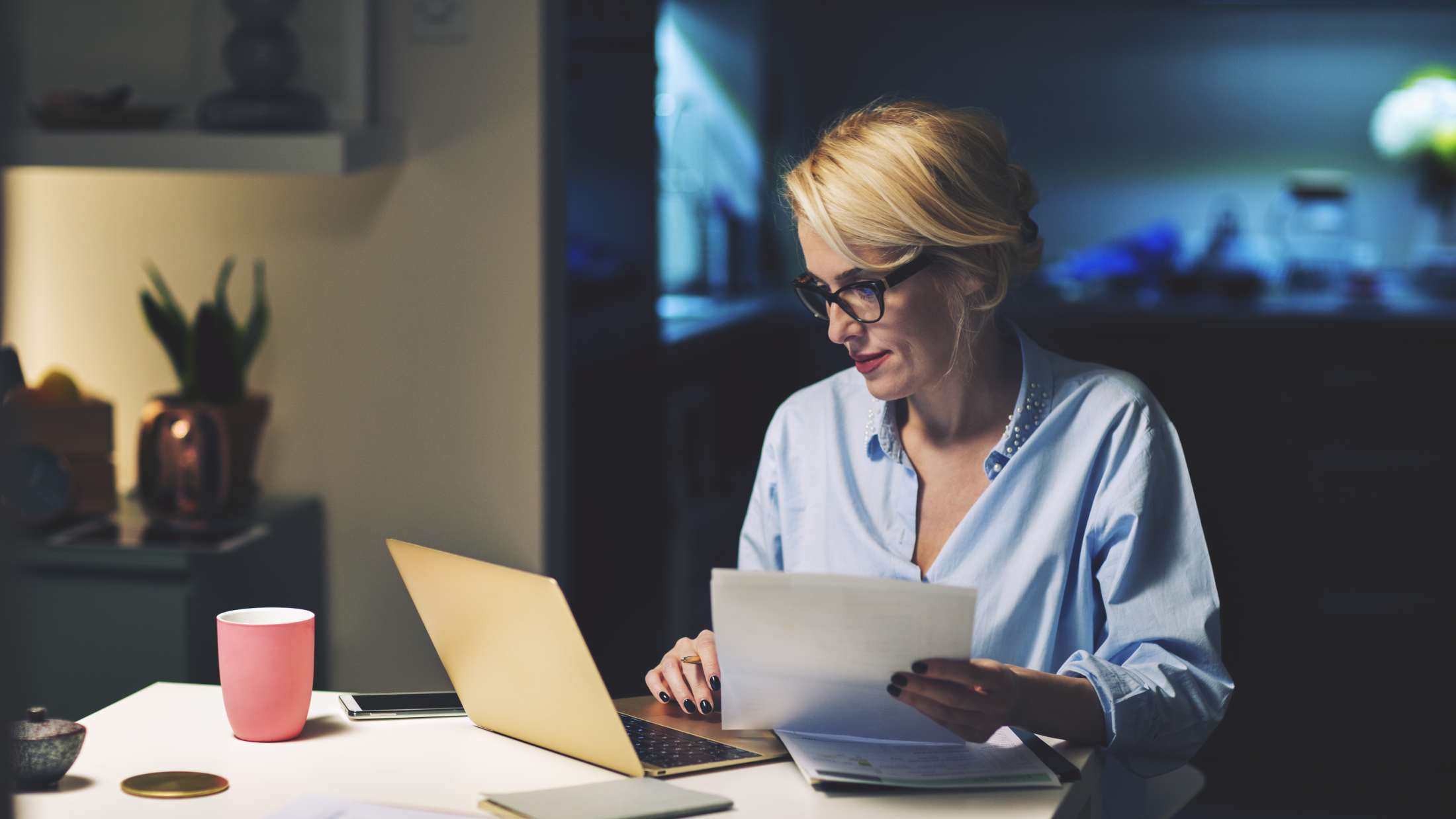 Broker using a laptop while working at home