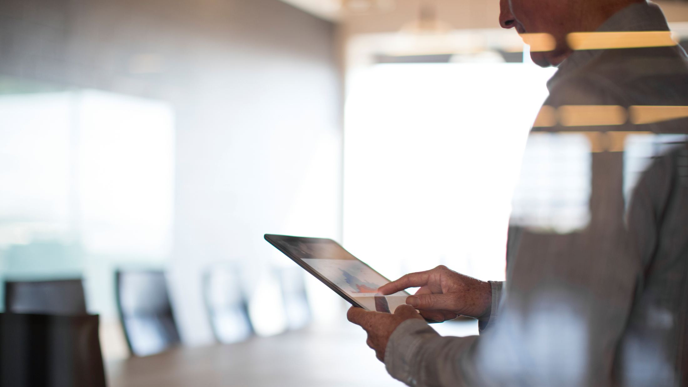 Businessman using a tablet in a conference room