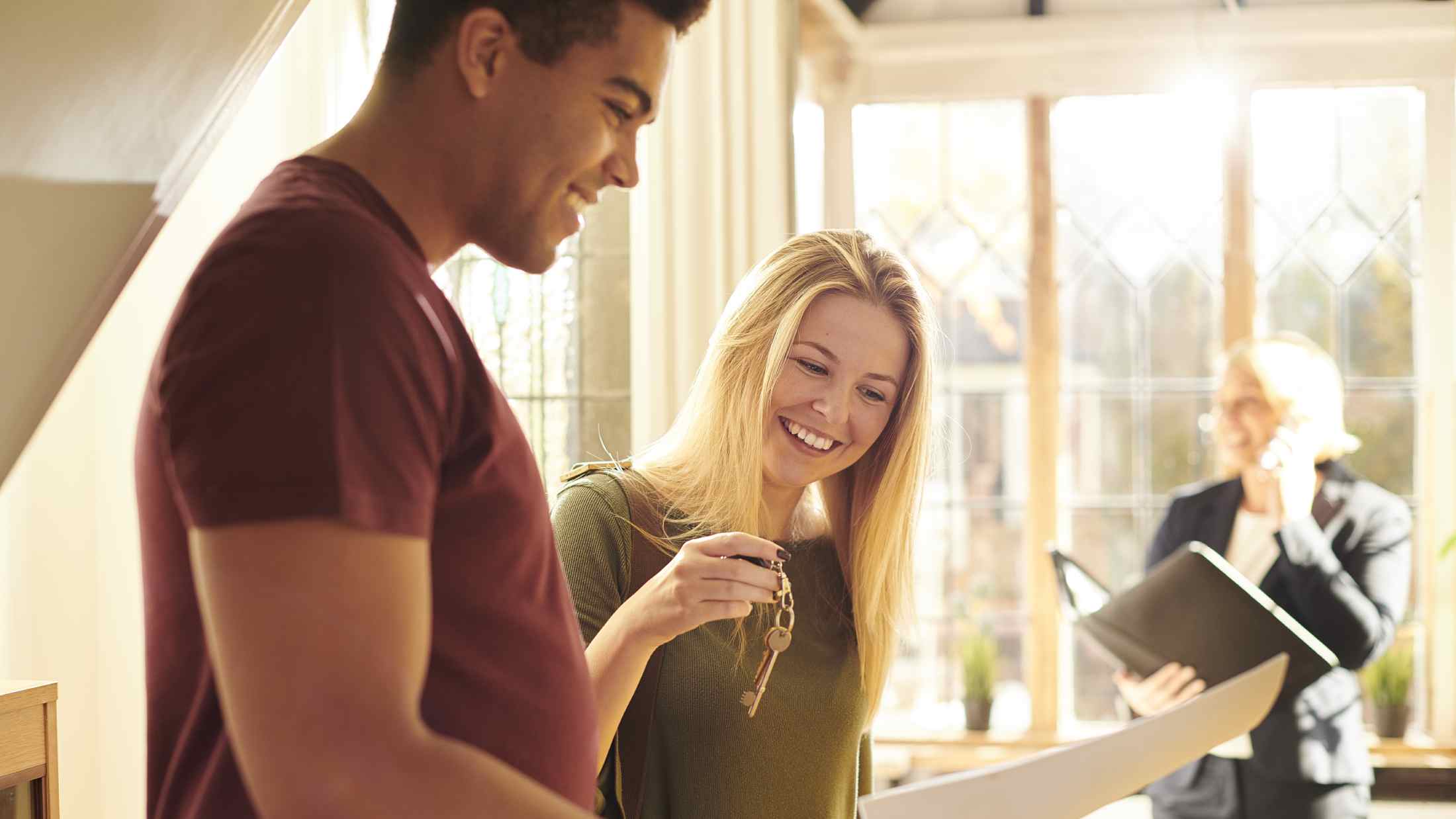 Couple renting home get keys from landlord