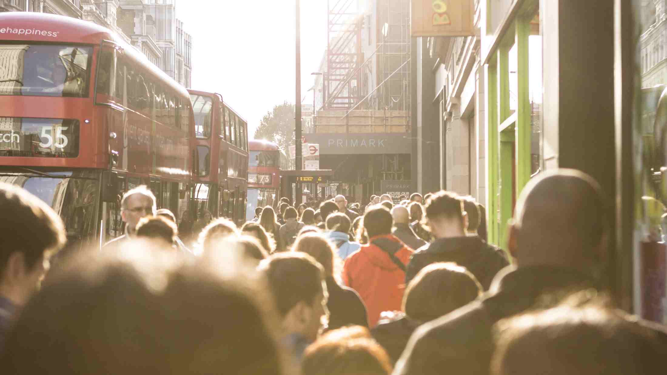 Crowd walking down street in London