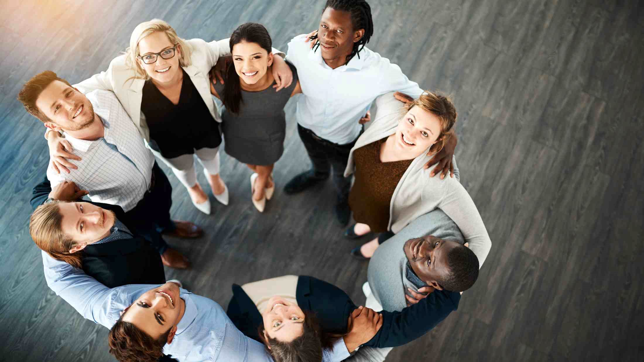 High angle portrait of a group of young business people huddled together in solidarity