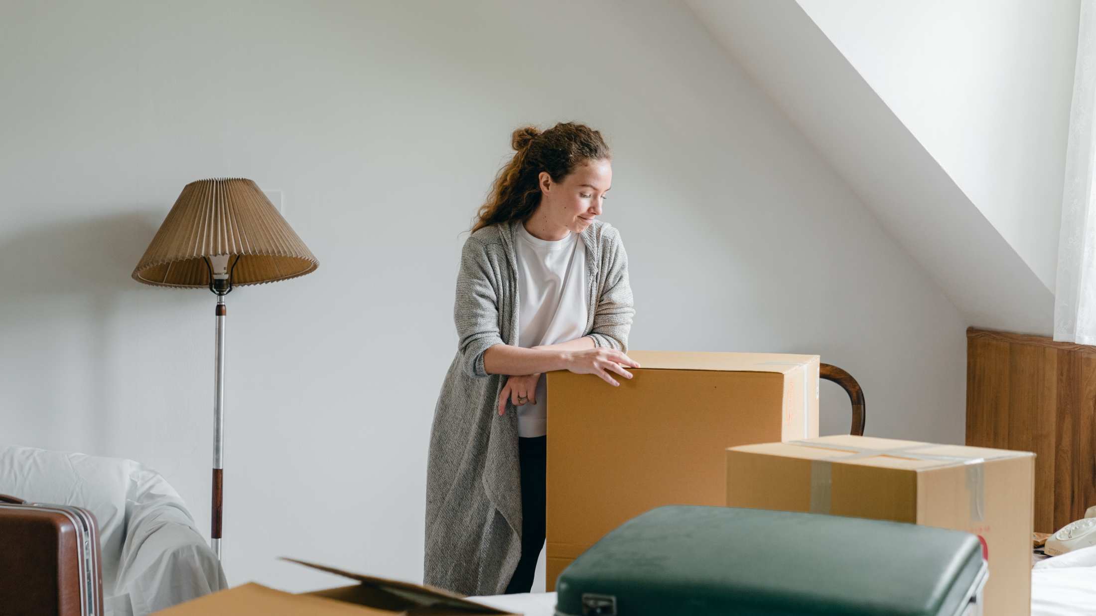 Woman packing a box ready to move