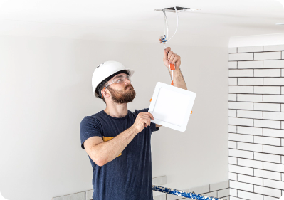 electrician inspecting wires