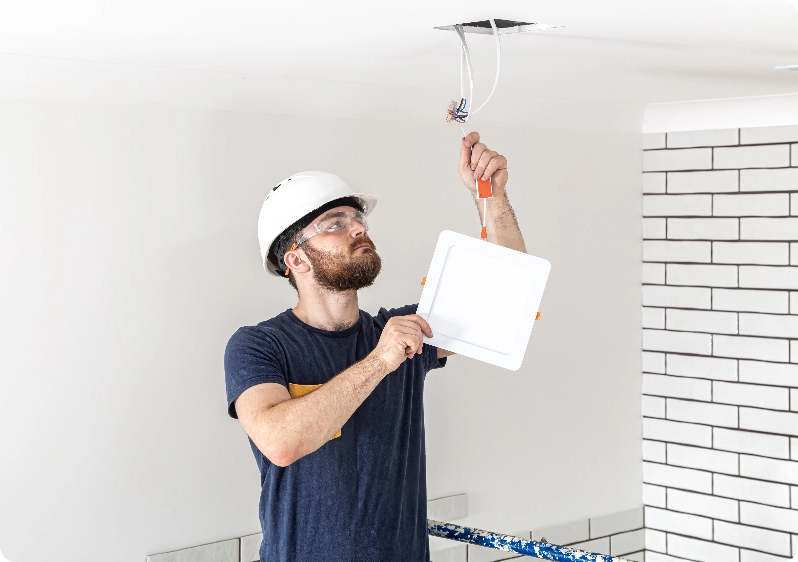 electrician inspecting wires
