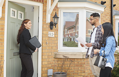 young couple viewing a house for sale