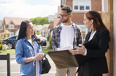 young couple viewing a house for sale