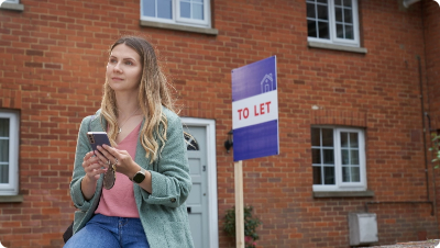 Woman standing in front of a flat