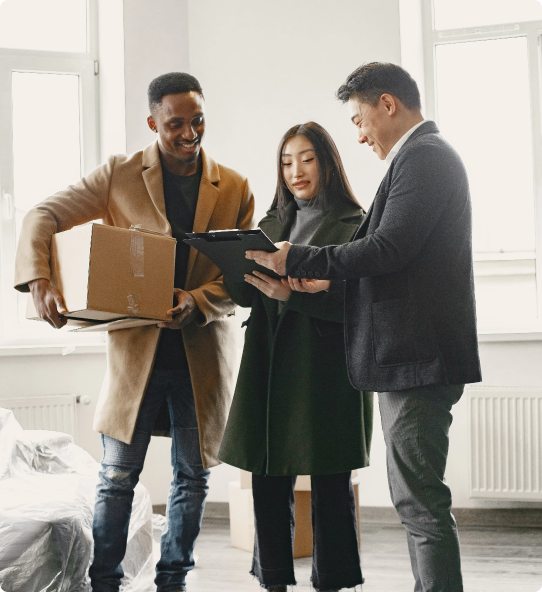 Young couple signing documents for a new home